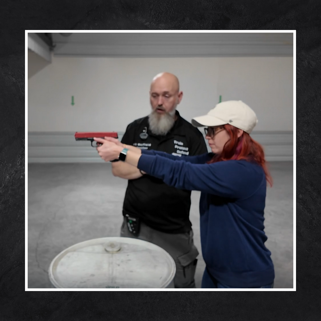 Instructor and student demonstrating firearm fundamentals
