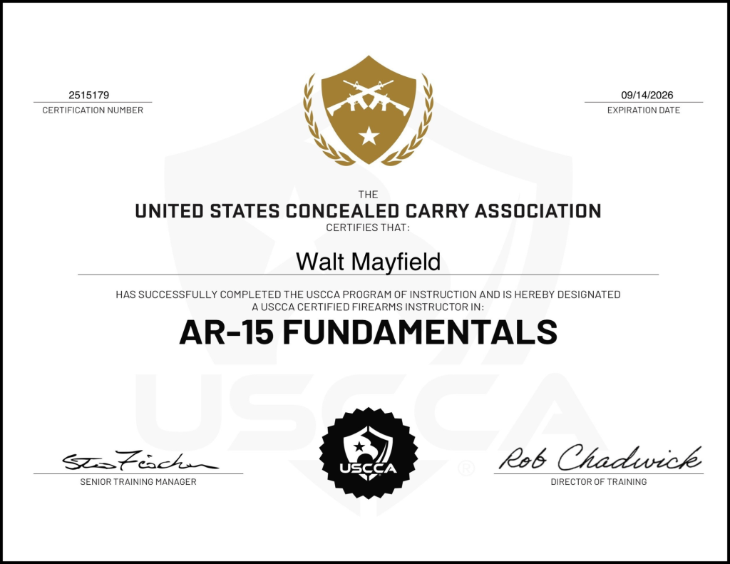 A certification document from the United States Concealed Carry Association, issued to Walt Mayfield, confirming completion of the AR-15 Fundamentals course, signed by the Senior Training Manager and Director of Training.