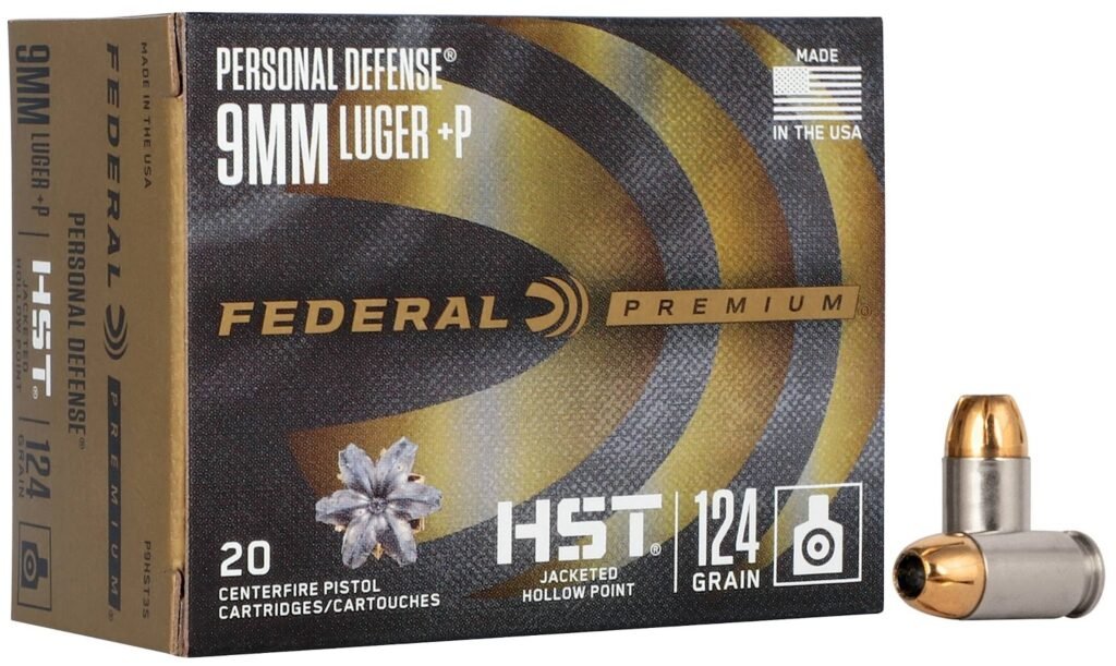 A box of Federal Premium 9mm Luger +P ammunition labeled as "Personal Defense," containing 20 cartridges. A single hollow point bullet is positioned next to the box for display.