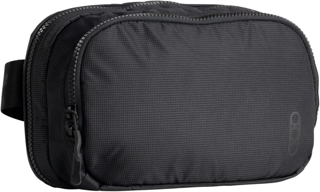 A black travel toiletry bag with a zippered closure and a textured surface, designed for organizing personal care items. The bag features a small handle on the side for easy carrying.